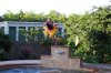 katelyn jumping off fountain..jpg