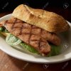 87411203-grilled-andouille-sausage-sandwich-on-artisanal-bread.jpg