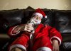 24099366-drunk-Santa-Claus-posing-with-a-bottle-of-whisky-Stock-Photo.jpg